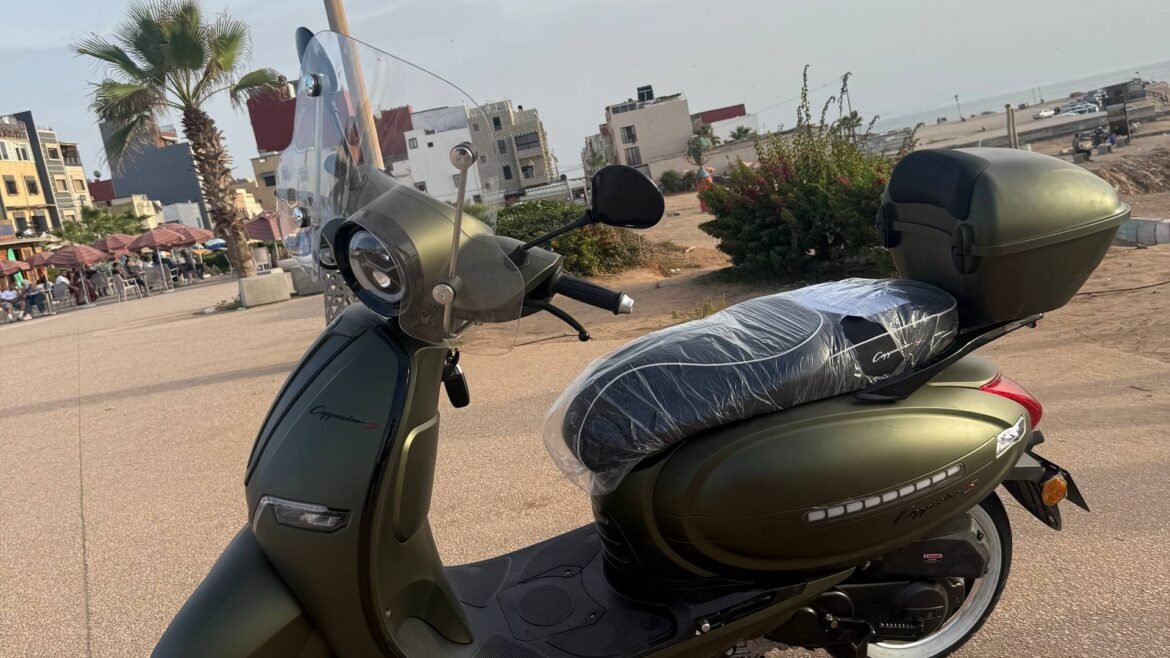 Cappuccino S 50cc scooter for rent in olive green with windshield and top case, Tamraght beach