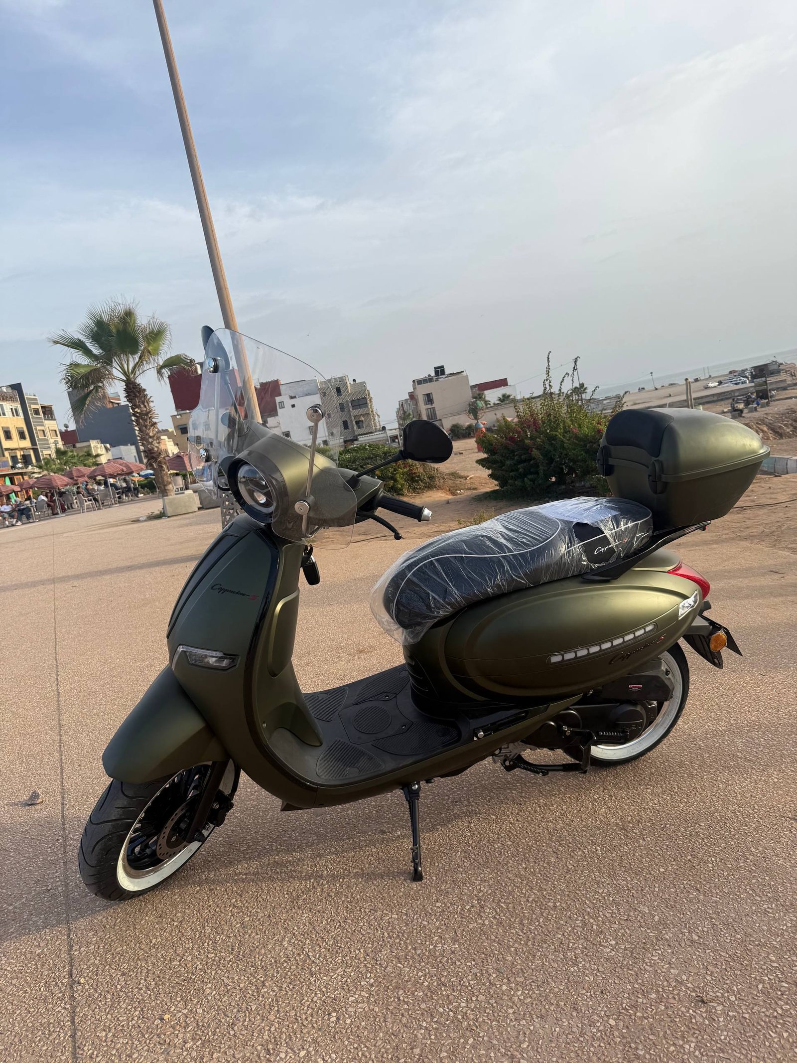 Cappuccino S 50cc scooter for rent in olive green with windshield and top case, Tamraght beach