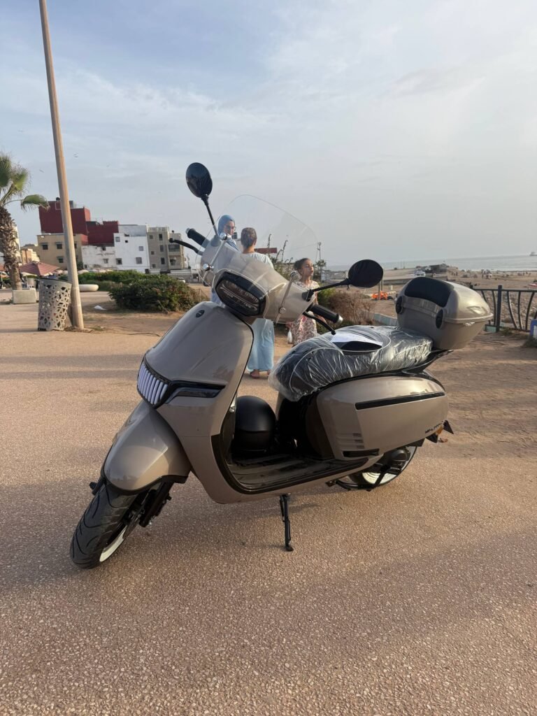 Mojito S 49cc scooter for rent in beige with LED grille, windshield and top case, Tamraght beach