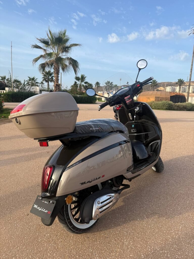 Mojito S 49cc scooter rental rear view with chrome exhaust and top case